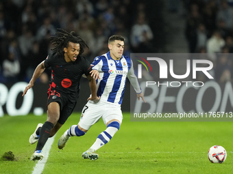 Jules Kounde centre-back of Barcelona and France and Ander Barrenetxea left winger of Real Sociedad and Spain compete for the ball during th...