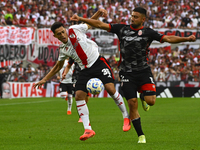 Pablo Solari of River Plate competes for the ball against Nicolas Demartini of Barracas Central during a Liga Profesional 2024 match between...