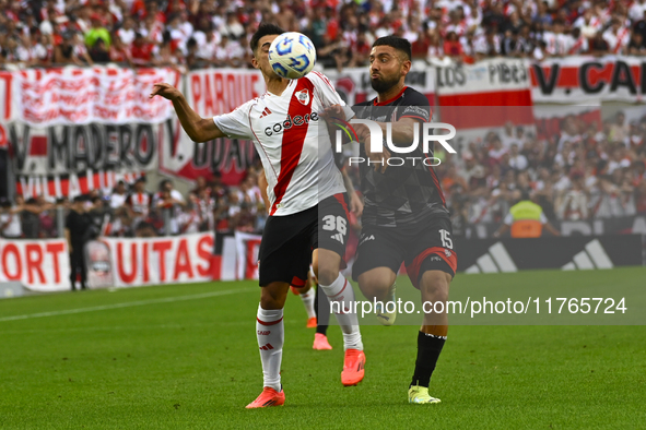 Pablo Solari of River Plate competes for the ball against Nicolas Demartini of Barracas Central during a Liga Profesional 2024 match between...