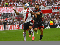 Pablo Solari of River Plate competes for the ball against Nicolas Demartini of Barracas Central during a Liga Profesional 2024 match between...