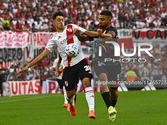 Pablo Solari of River Plate competes for the ball against Nicolas Demartini of Barracas Central during a Liga Profesional 2024 match between...