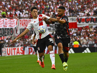 Pablo Solari of River Plate competes for the ball against Nicolas Demartini of Barracas Central during a Liga Profesional 2024 match between...