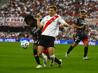 Facundo Colidio of River Plate competes for the ball against Carlos Sanchez of Barracas Central during a Liga Profesional 2024 match between...