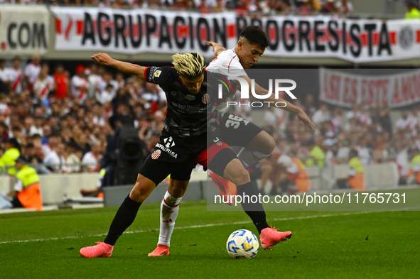 Pablo Solari of River Plate competes for the ball against Rodrigo Insua of Barracas Central during a Liga Profesional 2024 match between Riv...