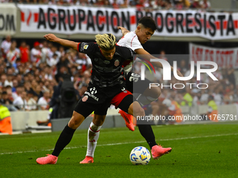 Pablo Solari of River Plate competes for the ball against Rodrigo Insua of Barracas Central during a Liga Profesional 2024 match between Riv...