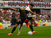 Pablo Solari of River Plate competes for the ball against Rodrigo Insua of Barracas Central during a Liga Profesional 2024 match between Riv...