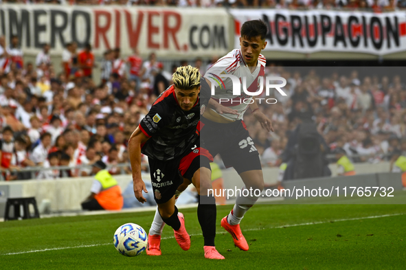 Pablo Solari of River Plate competes for the ball against Rodrigo Insua of Barracas Central during a Liga Profesional 2024 match between Riv...