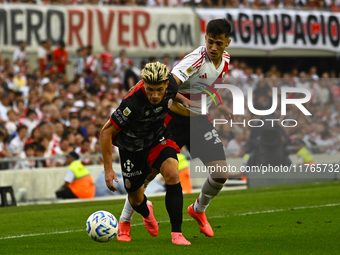 Pablo Solari of River Plate competes for the ball against Rodrigo Insua of Barracas Central during a Liga Profesional 2024 match between Riv...