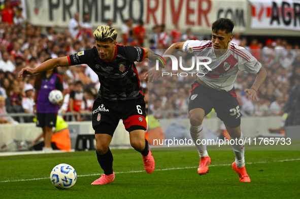 Pablo Solari of River Plate competes for the ball against Rodrigo Insua of Barracas Central during a Liga Profesional 2024 match between Riv...