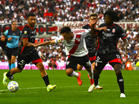 Pablo Solari of River Plate competes for the ball against Carlos Sanchez of Barracas Central during a Liga Profesional 2024 match between Ri...