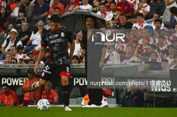 Ruben Insua, coach of Barracas Central, gives instructions to his team players during a Liga Profesional 2024 match between River Plate and...