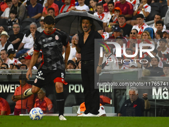 Ruben Insua, coach of Barracas Central, gives instructions to his team players during a Liga Profesional 2024 match between River Plate and...