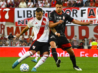 Leandro Gonzalez Pirez of River Plate competes for the ball against Nicolas Caparro of Barracas Central during a Liga Profesional 2024 match...