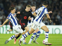 Fermin Lopez central midfield of Barcelona and Spain surrounded by Real Sociedad players during the LaLiga match between Real Sociedad and F...