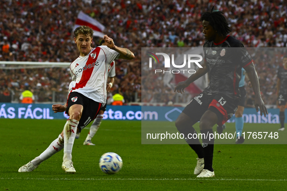 Facundo Colidio of River Plate competes for the ball against Carlos Sanchez of Barracas Central during a Liga Profesional 2024 match between...