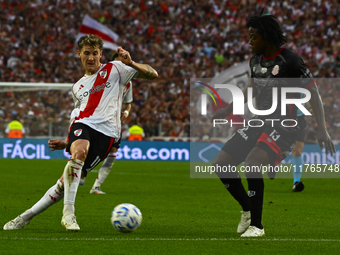 Facundo Colidio of River Plate competes for the ball against Carlos Sanchez of Barracas Central during a Liga Profesional 2024 match between...