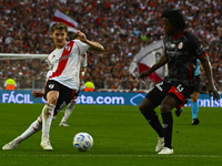 Facundo Colidio of River Plate competes for the ball against Carlos Sanchez of Barracas Central during a Liga Profesional 2024 match between...