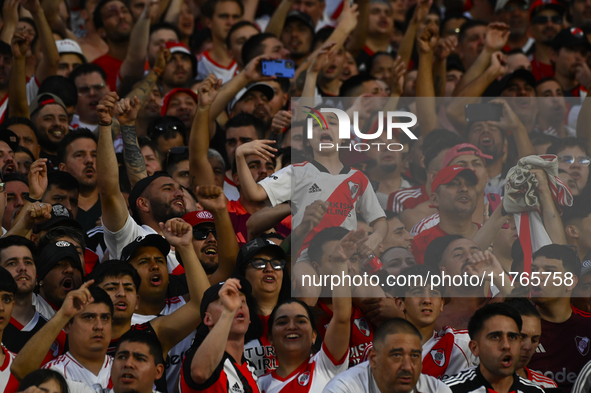 Fans of River Plate show their support for their team during a Liga Profesional 2024 match against Barracas Central at the Estadio Antonio V...