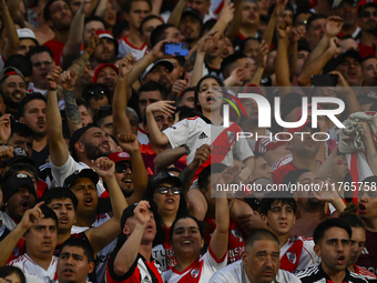 Fans of River Plate show their support for their team during a Liga Profesional 2024 match against Barracas Central at the Estadio Antonio V...