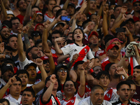 Fans of River Plate show their support for their team during a Liga Profesional 2024 match against Barracas Central at the Estadio Antonio V...