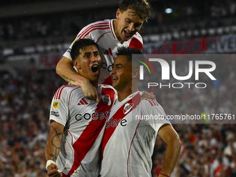 Maxi Meza, Pity Martinez, and Facundo Colidio of River Plate celebrate after scoring the team's first goal during a Liga Profesional 2024 ma...