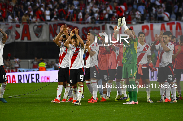 Claudio Echeverry and Franco Armani of River Plate celebrate with their teammates after winning a Liga Profesional 2024 match between River...