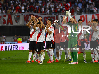 Claudio Echeverry and Franco Armani of River Plate celebrate with their teammates after winning a Liga Profesional 2024 match between River...