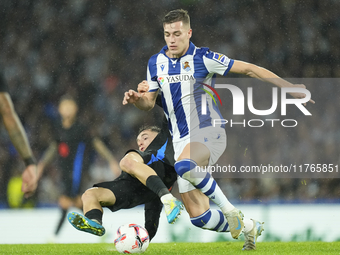 Luka Sucic central midfield of Real Sociedad and Croatia and Marc Casado defensive midfield of Barcelona and Spain compete for the ball duri...