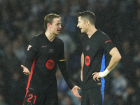 Frenkie de Jong central midfield of Barcelona and Netherlands and Robert Lewandowski centre-forward of Barcelona and Poland talk after Real...