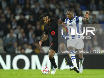 Jules Kounde centre-back of Barcelona and France and Sheraldo Becker centre-forward of Real Sociedad and Netherlands compete for the ball du...