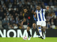 Jules Kounde centre-back of Barcelona and France and Sheraldo Becker centre-forward of Real Sociedad and Netherlands compete for the ball du...