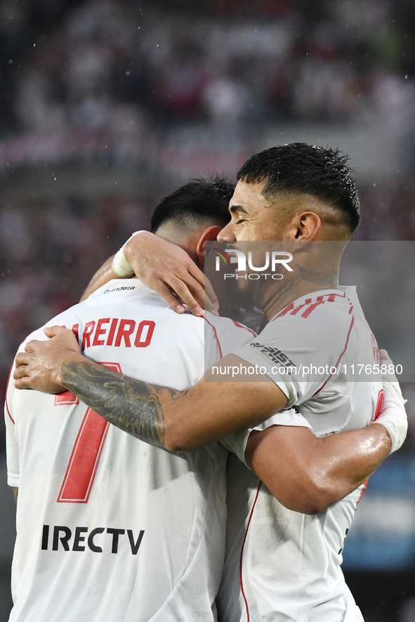 Adam Barreiro and Paulo Diaz of River Plate celebrate their team's goal during the match between River Plate and Barracas Central at Estadio...