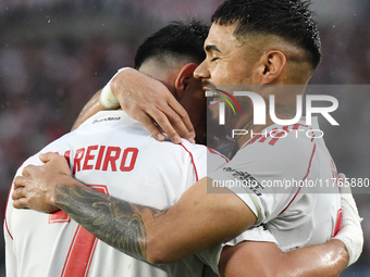 Adam Barreiro and Paulo Diaz of River Plate celebrate their team's goal during the match between River Plate and Barracas Central at Estadio...