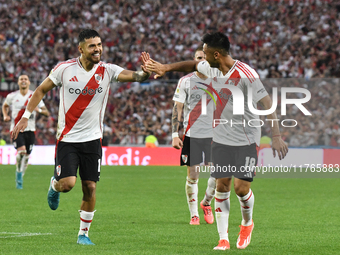 Paulo Diaz and Gonzalo Martinez of River Plate celebrate their team's goal during the match between River Plate and Barracas Central at Esta...