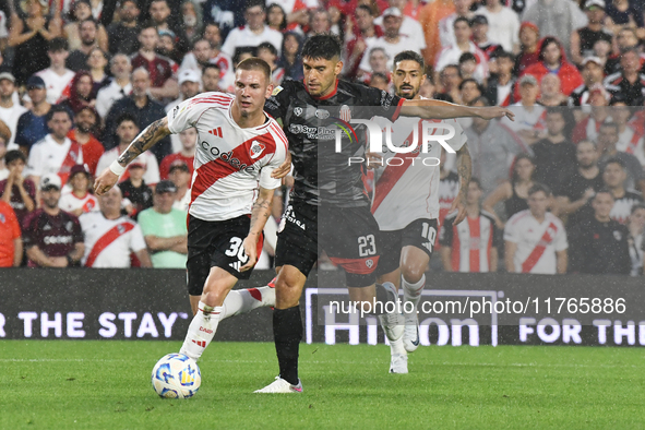 Franco Mastantuono of River Plate and Lucas Faggioli of Barracas Central compete for the ball during the match between River Plate and Barra...