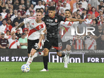 Franco Mastantuono of River Plate and Lucas Faggioli of Barracas Central compete for the ball during the match between River Plate and Barra...