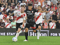 Franco Mastantuono of River Plate and Lucas Faggioli of Barracas Central compete for the ball during the match between River Plate and Barra...