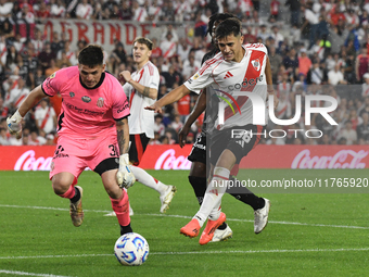 Pablo Solari of River Plate and Marcelo MNino of Barracas Central are present during the match between River Plate and Barracas Central at E...