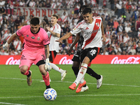 Pablo Solari of River Plate and Marcelo MNino of Barracas Central are present during the match between River Plate and Barracas Central at E...