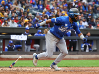 Emilio Bonifacio #64 of Los Tigres del Licey singles during the third inning of a baseball game against Las Aguilas Cibaenas at Citi Field i...