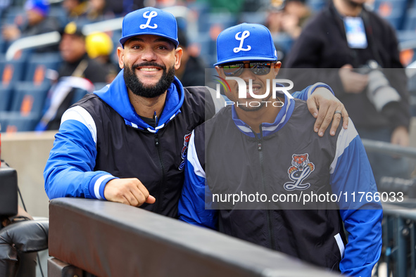 Los Tigres del Licey coach Hector Borg and manager Gilbert Gomez stand before the baseball game against Las Aguilas Cibaenas at Citi Field i...