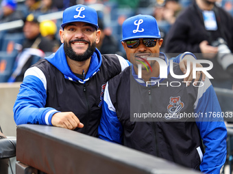 Los Tigres del Licey coach Hector Borg and manager Gilbert Gomez stand before the baseball game against Las Aguilas Cibaenas at Citi Field i...