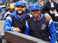 Los Tigres del Licey coach Hector Borg and manager Gilbert Gomez stand before the baseball game against Las Aguilas Cibaenas at Citi Field i...