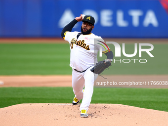 Las Aguilas Cibaenas starting pitcher Johnny Cueto #47 throws during the first inning of a baseball game against Los Tigres del Licey at Cit...