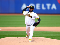 Las Aguilas Cibaenas starting pitcher Johnny Cueto #47 throws during the first inning of a baseball game against Los Tigres del Licey at Cit...