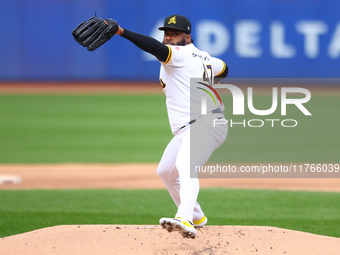 Las Aguilas Cibaenas starting pitcher Johnny Cueto #47 throws during the first inning of a baseball game against Los Tigres del Licey at Cit...