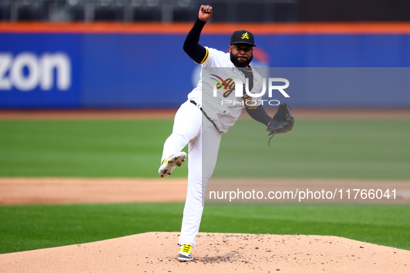 Las Aguilas Cibaenas starting pitcher Johnny Cueto #47 throws during the first inning of a baseball game against Los Tigres del Licey at Cit...