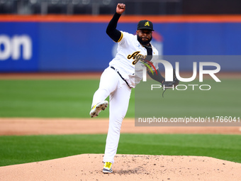 Las Aguilas Cibaenas starting pitcher Johnny Cueto #47 throws during the first inning of a baseball game against Los Tigres del Licey at Cit...