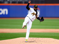 Las Aguilas Cibaenas starting pitcher Johnny Cueto #47 throws during the first inning of a baseball game against Los Tigres del Licey at Cit...