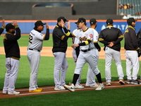 Las Aguilas Cibaena players and coaches are introduced before the baseball game against Los Tigres del Licey at Citi Field in Corona, N.Y.,...